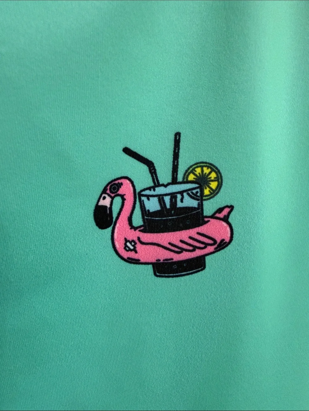 Sleeveless Mint Green Polo Tank with Pink Flamingo Float Motif. Great for golf